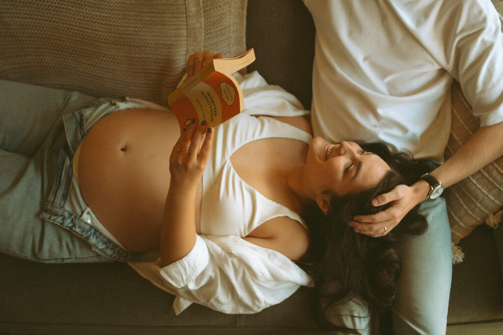 Expectant couple having tea during an in-home maternity photoshoot