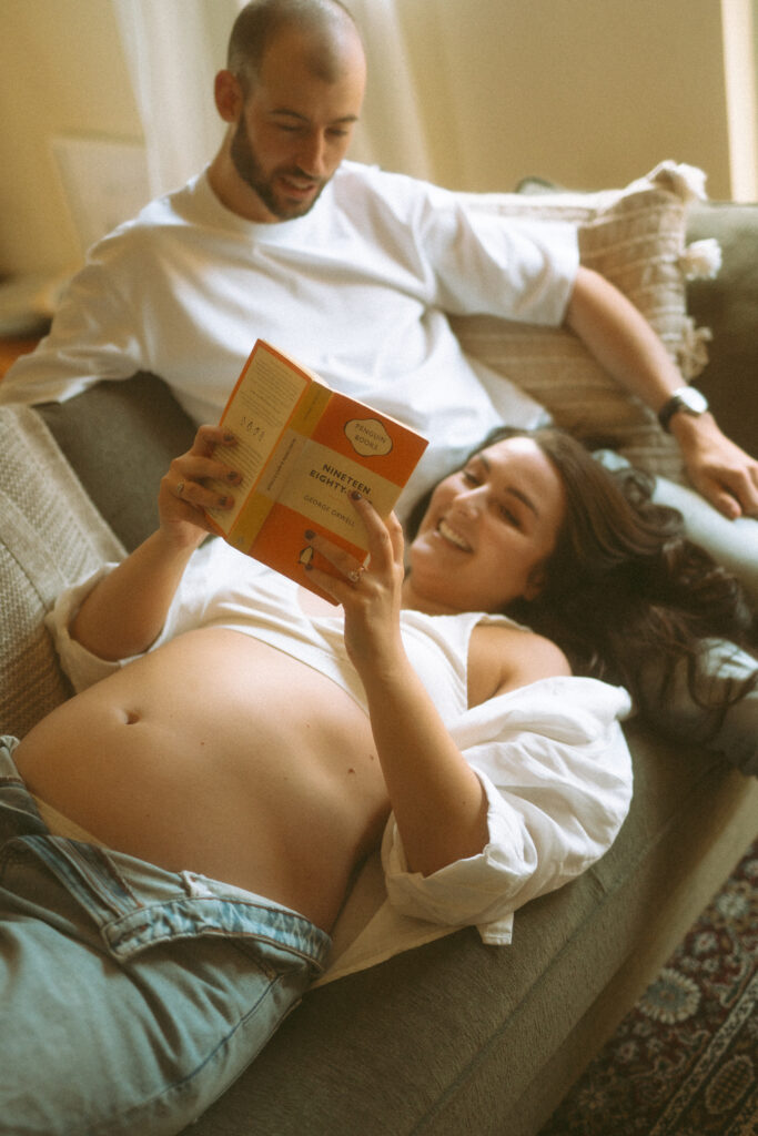 Expectant couple having tea during an in-home maternity photoshoot
