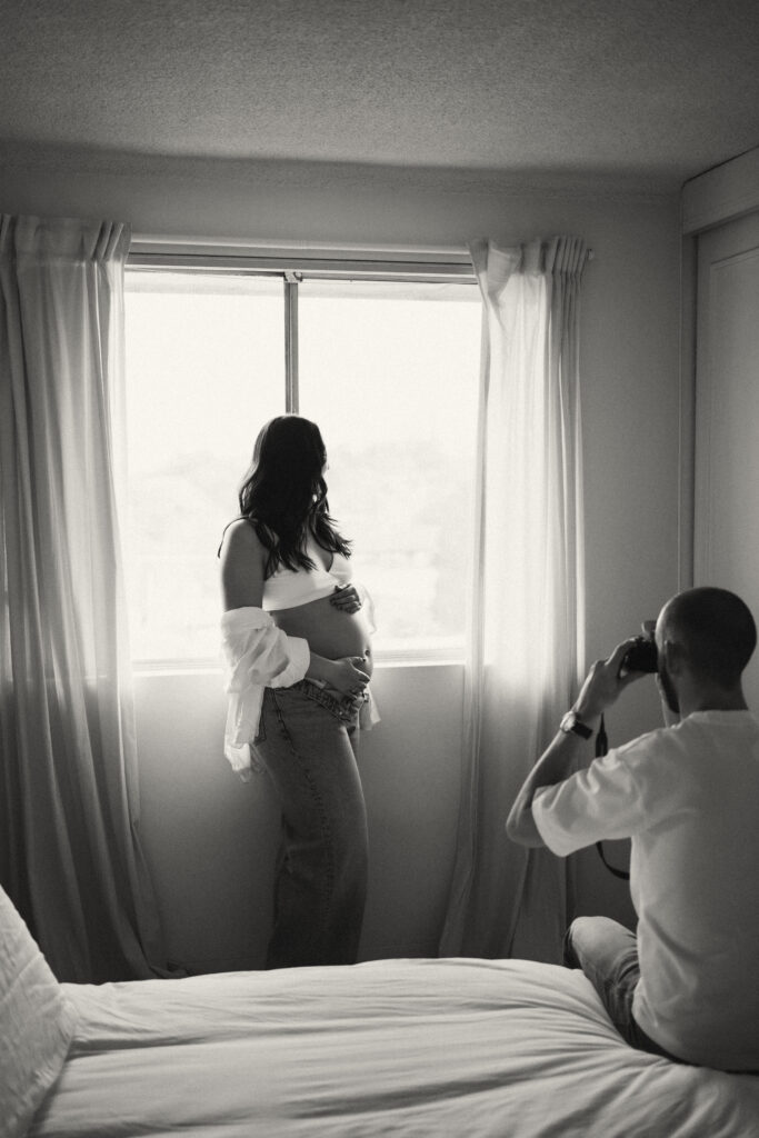 Expectant couple having tea during an in-home maternity photoshoot