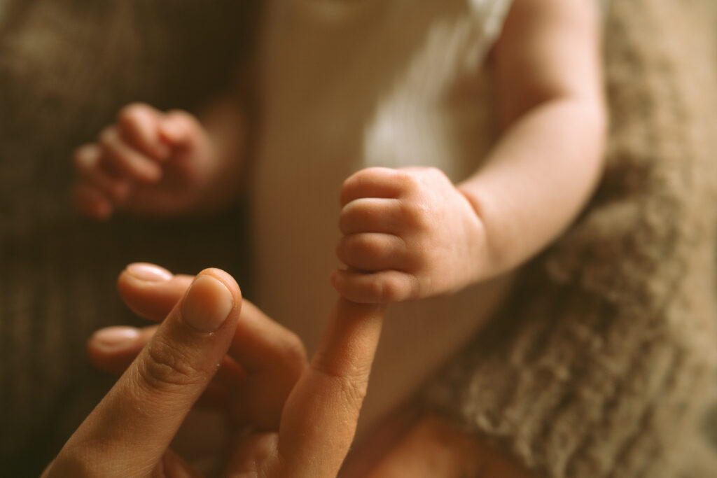 Close up of a newborn baby finger