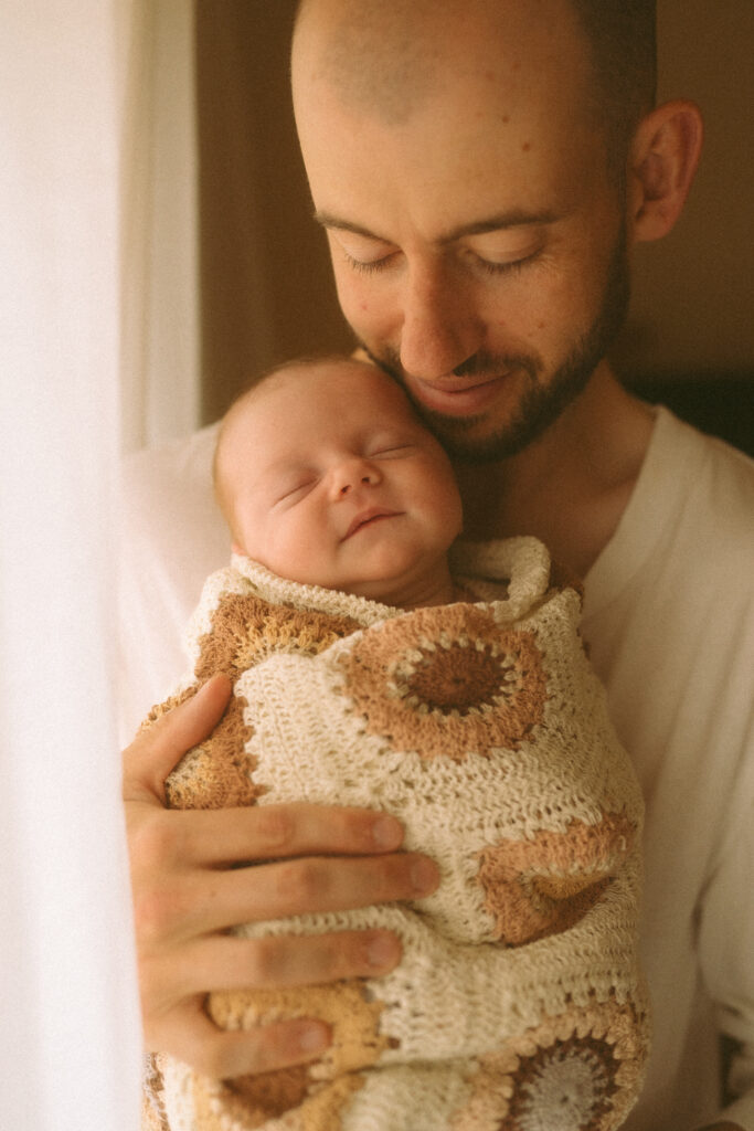 Father and newborn baby