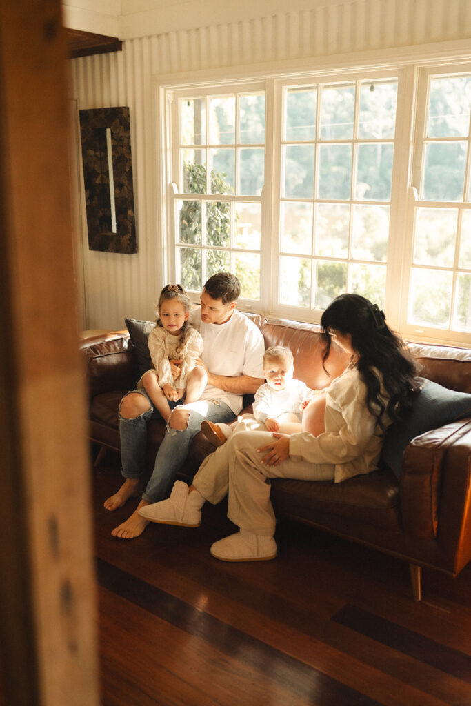 A family having staycation maternity photos taken