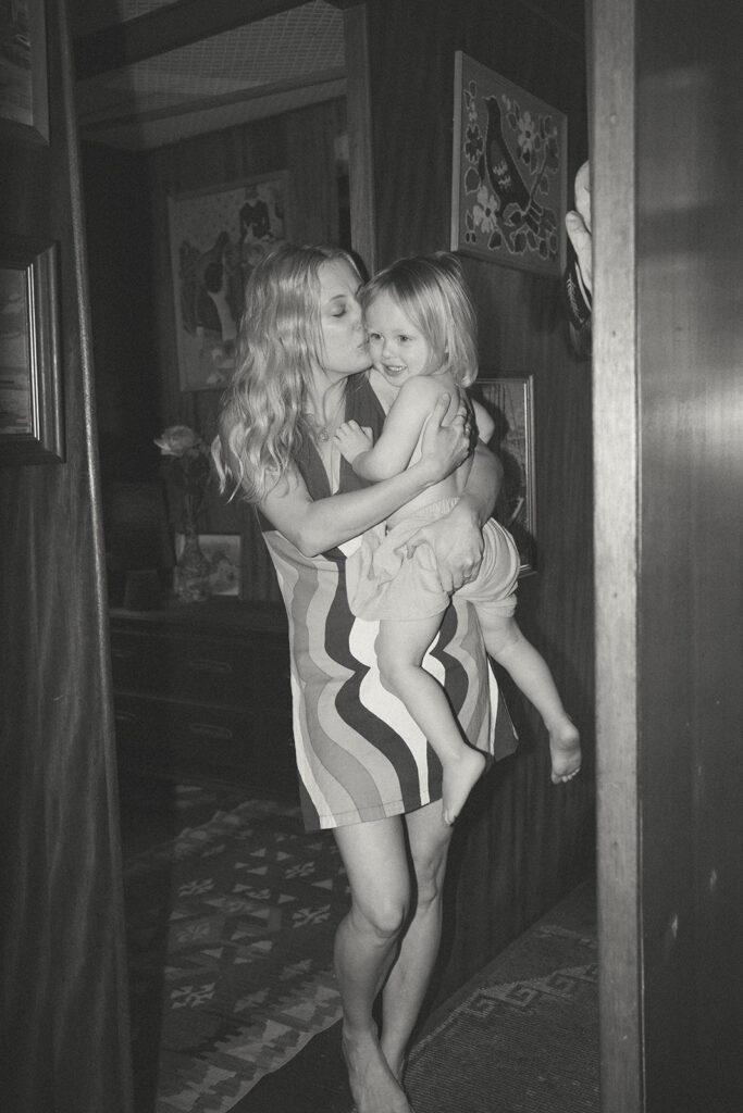 Emma and her son Cash on a vintage-style houseboat.