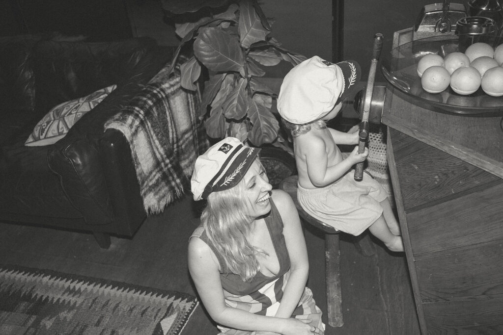 Emma and her son Cash on a vintage-style houseboat.