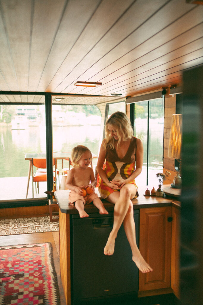 Emma and her son Cash on a vintage-style houseboat.