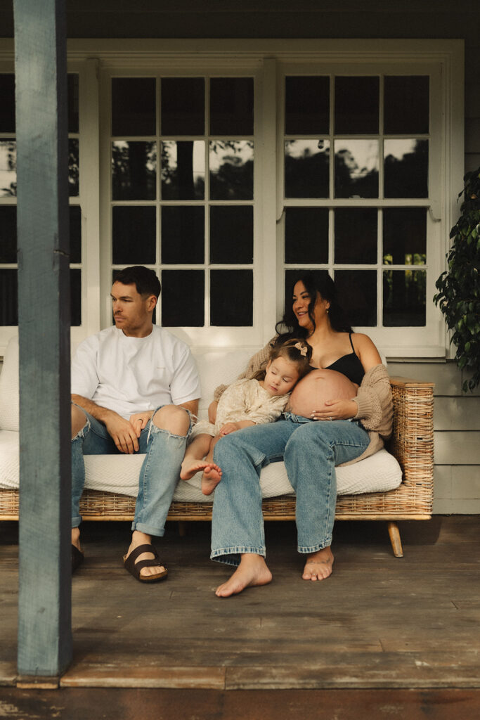 A family having staycation maternity photos taken