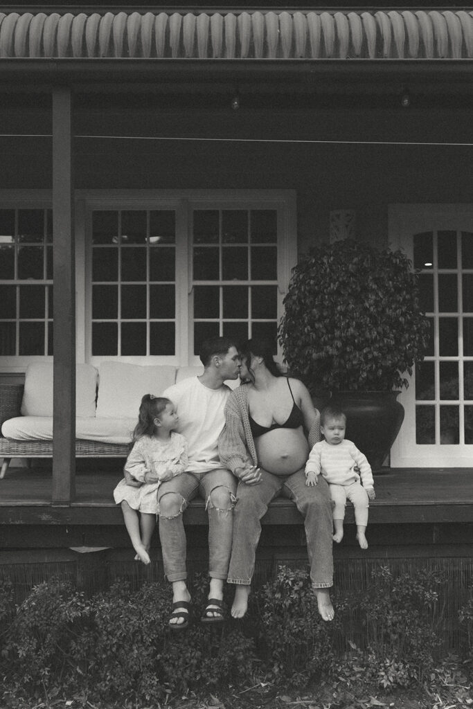 A family having staycation maternity photos taken