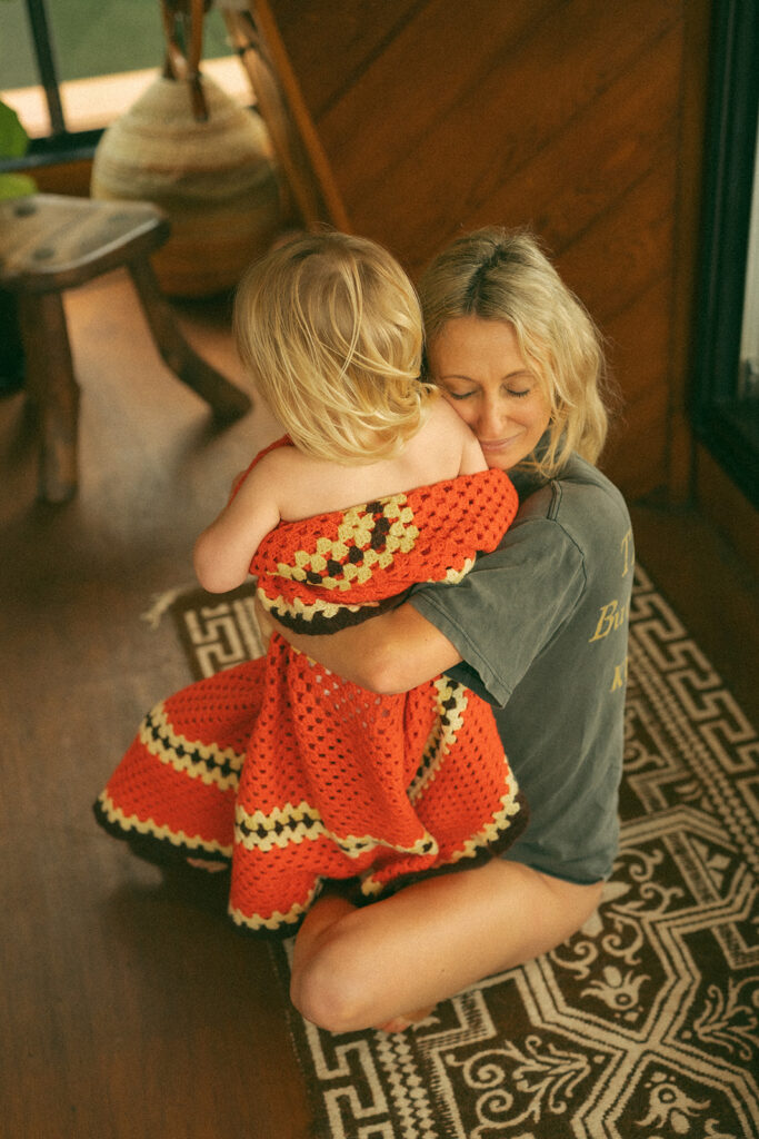 Emma and her son Cash on a vintage-style houseboat.