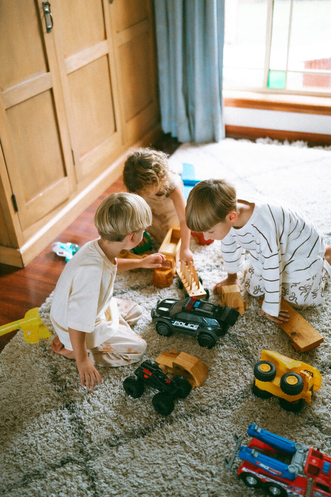 Kids playing during an in-home motherhood shoot