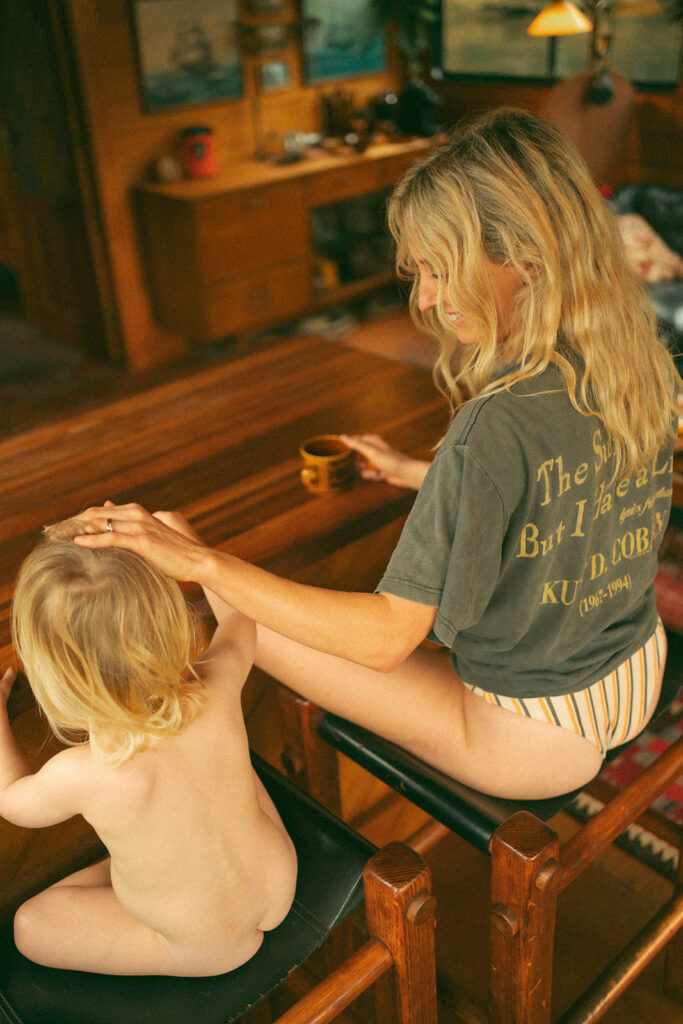 Emma and her son Cash on a vintage-style houseboat.