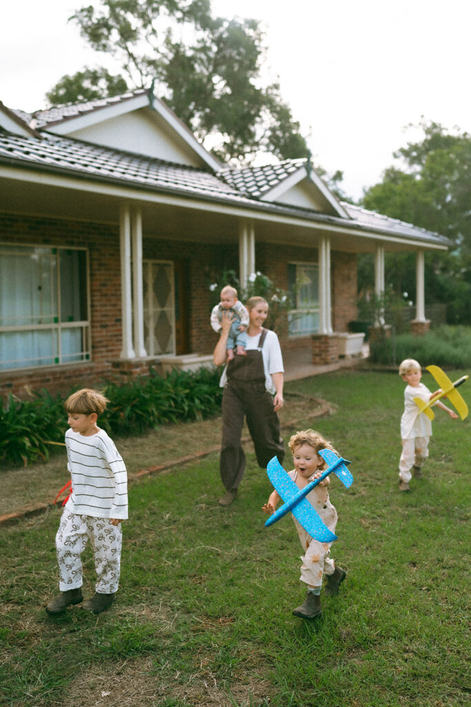 Kids playing during an in-home motherhood shoot