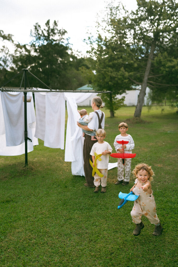 Kids playing during an in-home motherhood shoot