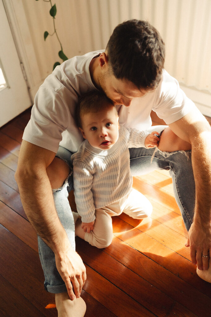 A family having staycation maternity photos taken