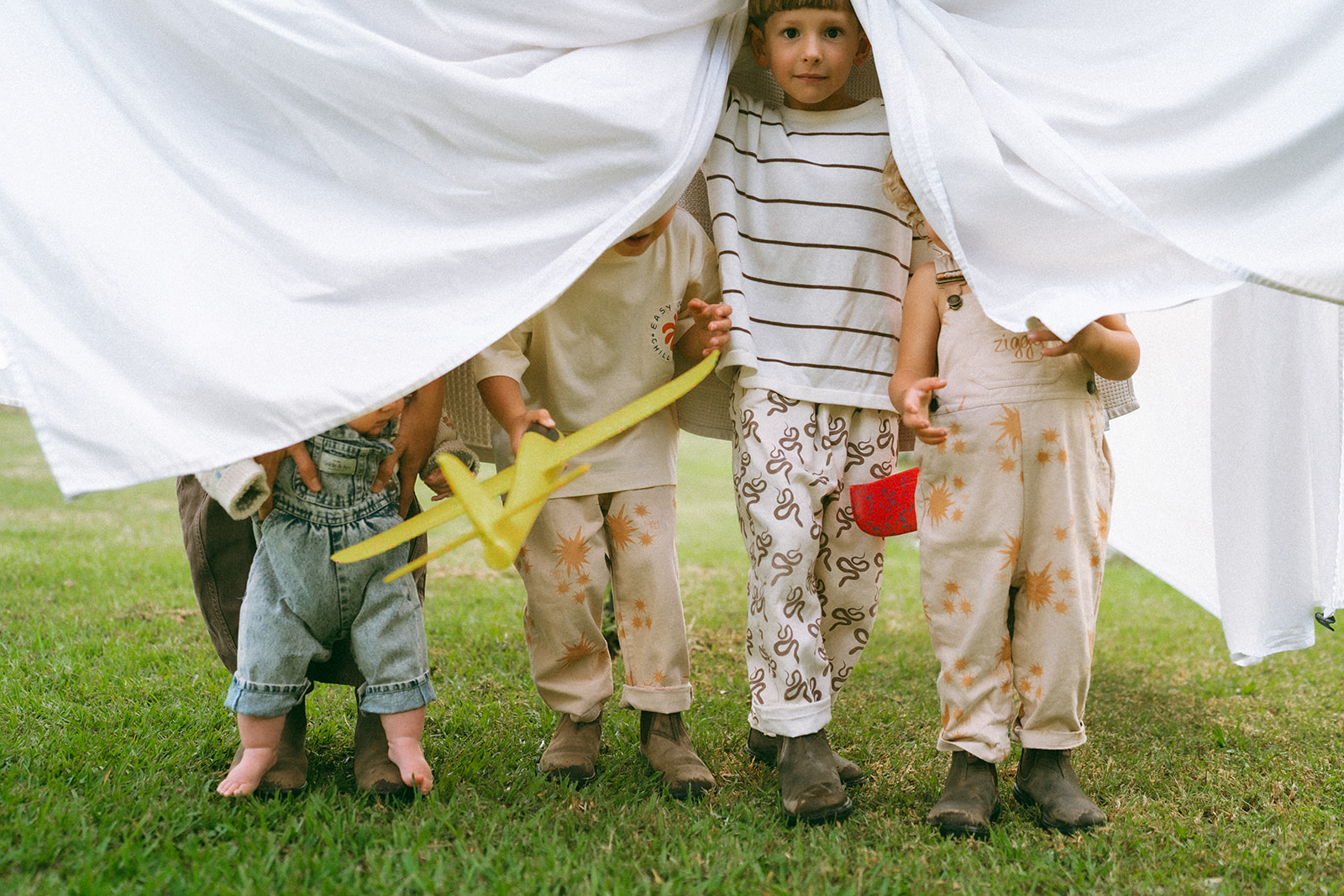 Kids playing during an in-home motherhood shoot