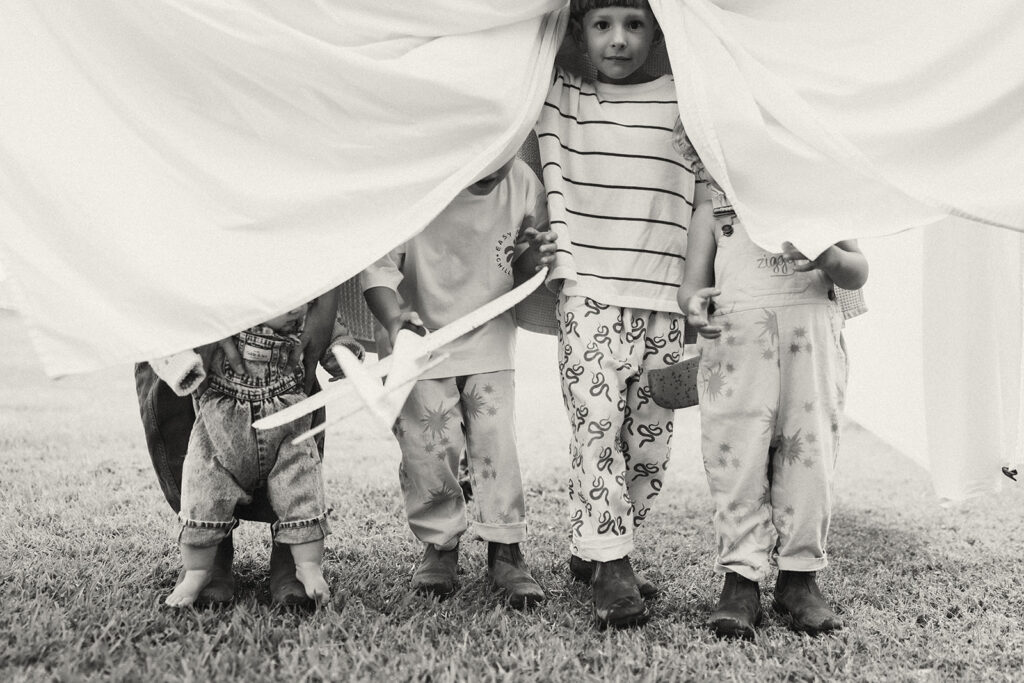 Kids playing during an in-home motherhood shoot