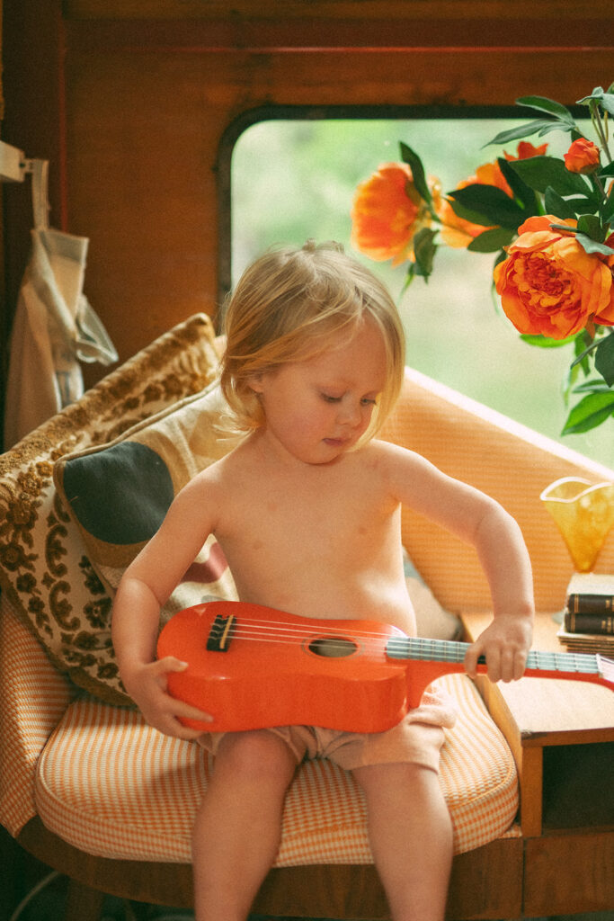 Emma and her son Cash on a vintage-style houseboat.