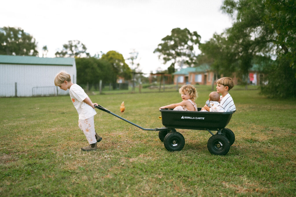 Kids playing during an in-home motherhood shoot